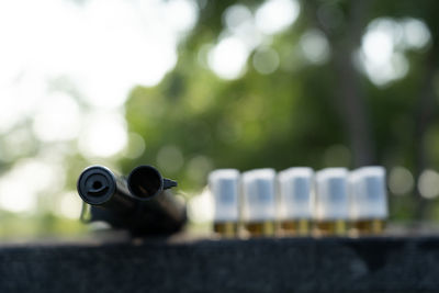 Close-up of coin-operated binoculars against sky