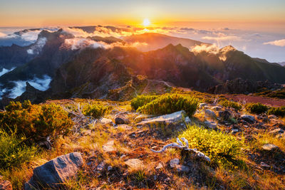 Scenic view of mountains against sky during sunset