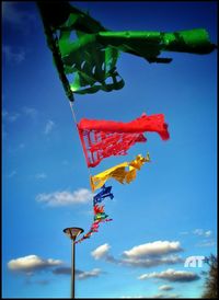 Low angle view of pole against blue sky