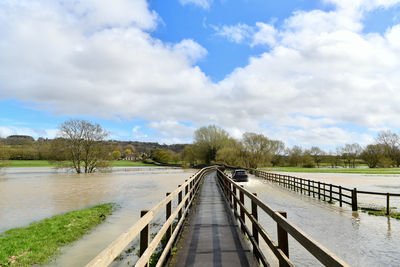 Bridge over river against sky