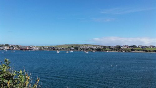 Scenic view of sea against blue sky