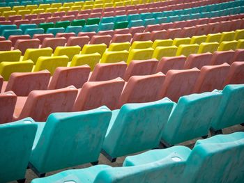 Row of multi colored bleachers in stadium