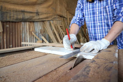 Man working on wooden table