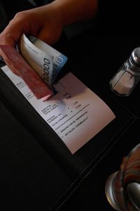 Close-up of hand holding table