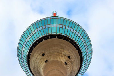 Low angle view of building against cloudy sky