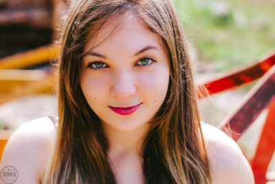Close-up portrait of a smiling young woman