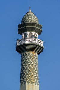 Low angle view of building against blue sky