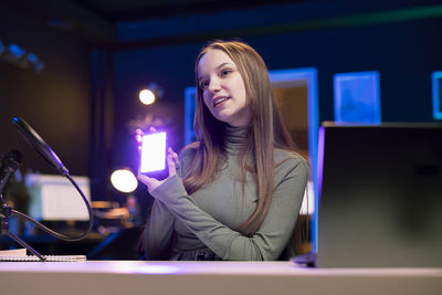 Young woman using laptop at home