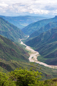 Scenic view of mountains against cloudy sky at chicamocha canyon