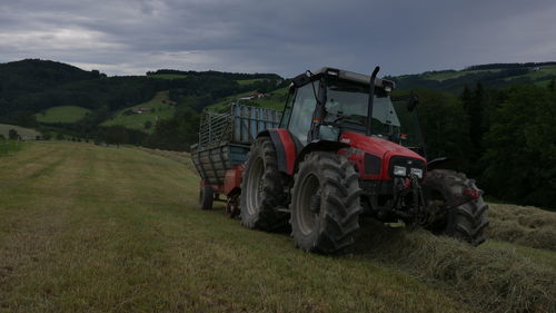 Tractor on field against sky