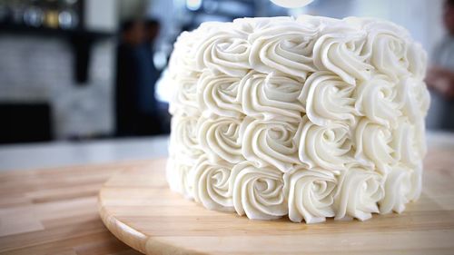 Close-up of white rose on table