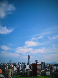 Cityscape against blue sky