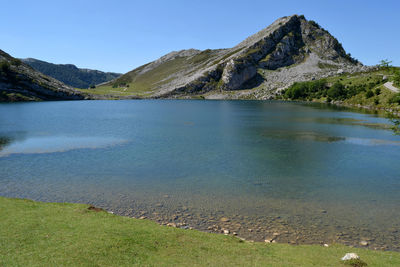 Scenic view of mountains against clear blue sky