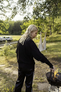 Woman having barbecue