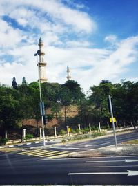 Road in city against sky