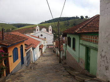 Houses in town against sky