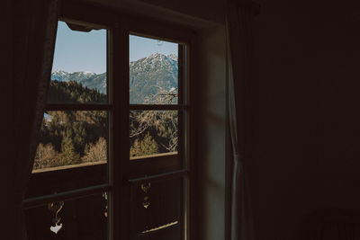 Mountains seen through window at home