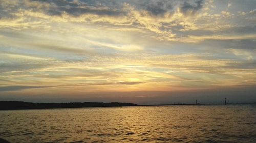 Scenic view of sea against sky at sunset