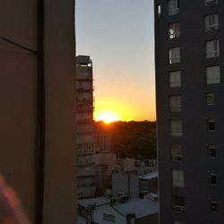 Cityscape against sky during sunset