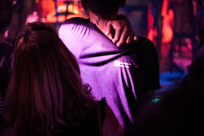 Midsection of woman dancing at nightclub