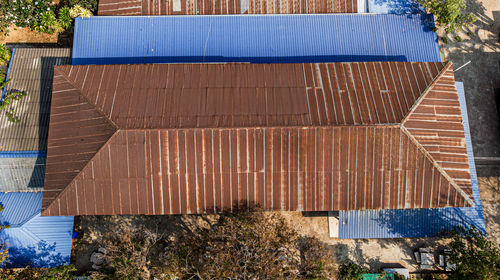 High angle view of trees by building