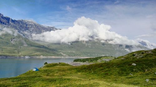 Scenic view of lake and mountains against sky