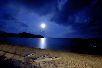 Scenic view of sea against sky at night