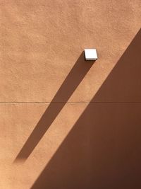 Shadow on brown wall