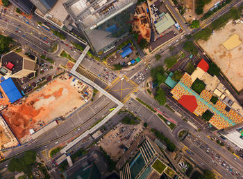 Aerial view of road amidst houses in town