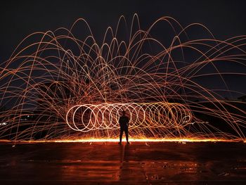 Man in the middle of the sparks