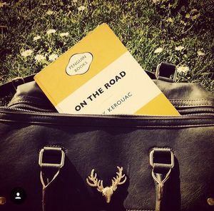 Close-up of human hand on tiled floor