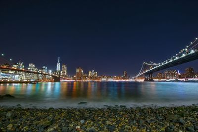 Bridge over river at night