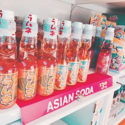 Close-up of various bottles on display at store