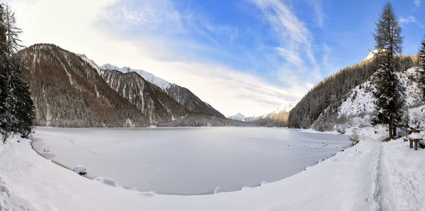 Scenic view of snow covered mountains against sky