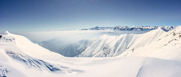 Scenic view of snowcapped mountains against sky