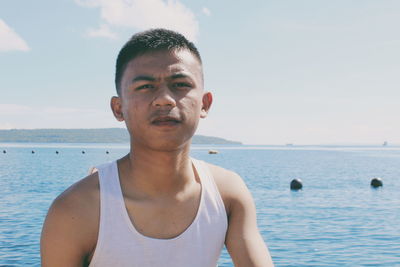 Portrait of man in sea against sky