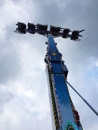 Low angle view of cranes against sky