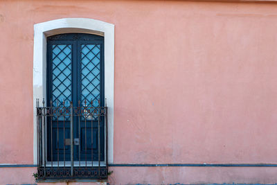Wrought iron door of an ancient sicilian house