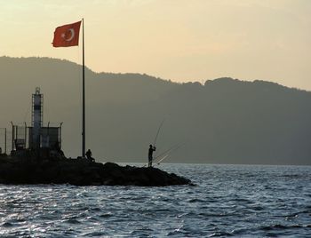 Scenic view of sea against sky during sunset