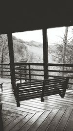 Empty wooden chairs and trees