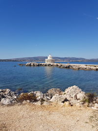 View of sea against blue sky