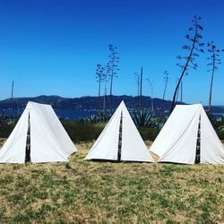 Tent on field against clear sky