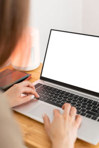 Woman using laptop on table