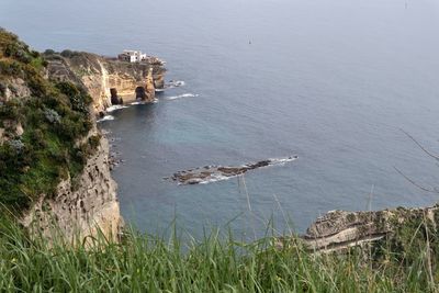 High angle view of rocks by sea