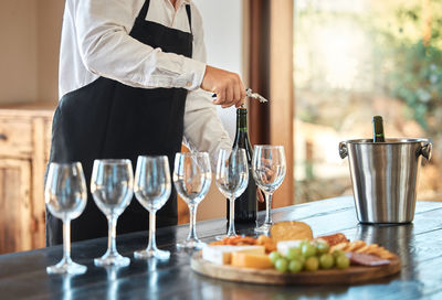 Midsection of man preparing food on table