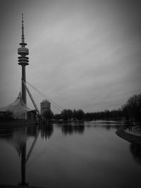 View of bridge over river against sky in city