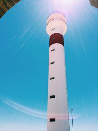 Low angle view of tower against blue sky