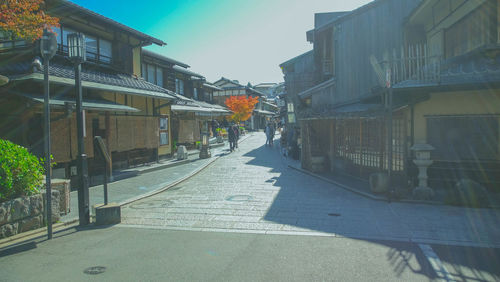 Street amidst buildings in city against sky