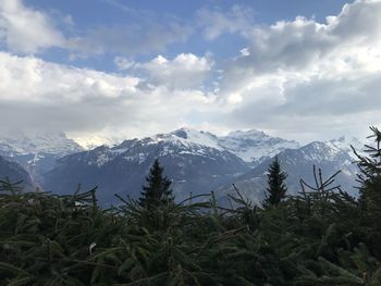 Scenic view of snowcapped mountains against sky
