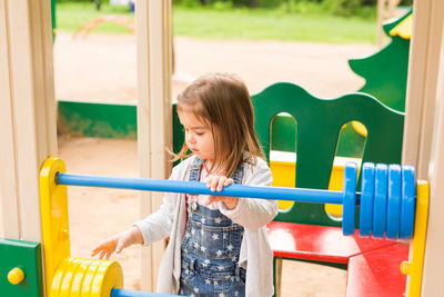 Cute girl playing in playground